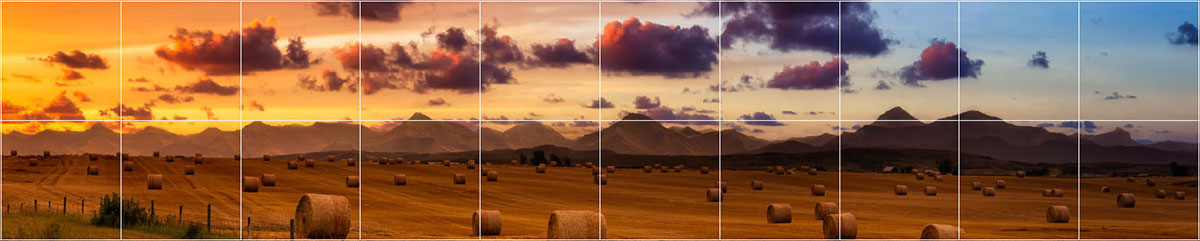 Sunset over farmland with hay bales