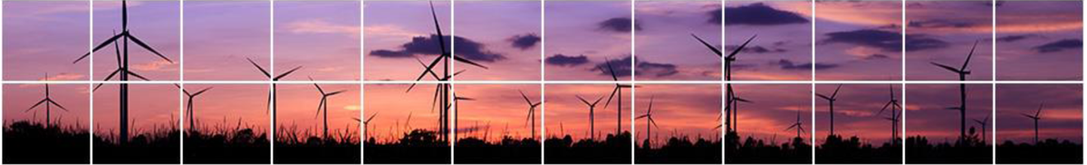 Pictured are wind turbines in a field with skies at dusk.