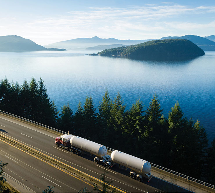 A transport truck driving along Highway 99, in British Columbia, Canada.