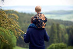 Father carrying child on his shoulders