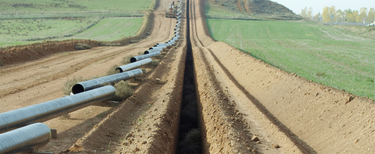 Pipeline laying beside open trench